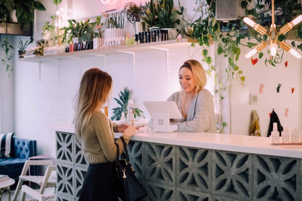 Business receptionist setting up auto attendant phone system