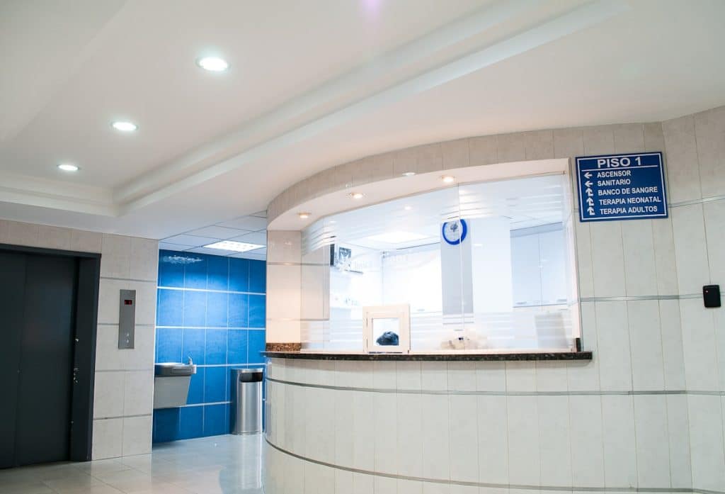 Medical office reception desk with phone system for patient calls